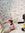 Girl pouring Mozzo espresso beans into an at-home grinder