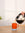 Drip coffee jug pouring coffee into an orange mug