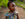 Medium close-up of a young girl named Noella, the first baby born in the Mozzo funded Hospital of Hope, DRC