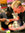 Mozzo US coffee training: Woman holding milk jug pouring into a takeaway cup held by a blonde tattooed man