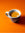 Espresso in a white mug on orange background
