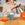 Woman pouring water in blue grey mug with Mozzo coffee bag box to one side
