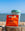 Mozzo HOUSE coffee bag against reusable coffee cup on the beach