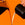 One clear jug pouring black coffee and one black jug pouring milk into the middle of the image and off screen